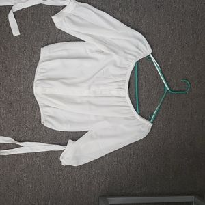 Ambiance shear shirt with ties on the arm.